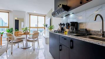 Fridge, microwave, stovetop, coffee/tea maker