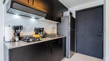 Fridge, microwave, stovetop, coffee/tea maker