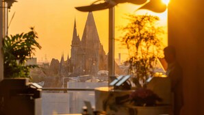 A view from a balcony overlooking a historic cathedral at sunset. - Nousland Beijing (Tongzhou)