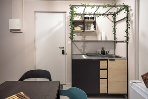 Fridge, microwave, stovetop, coffee/tea maker