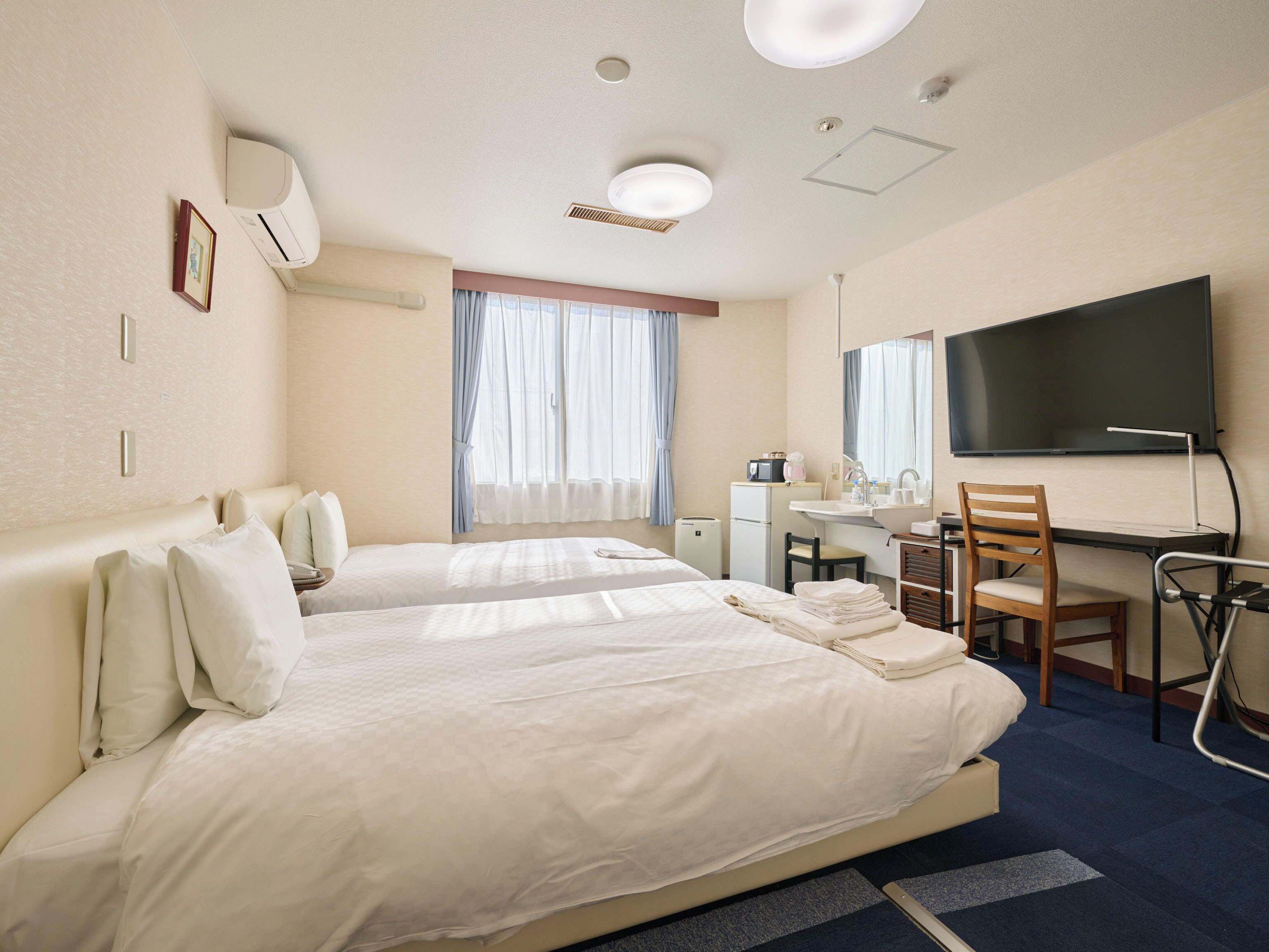 Habitación Deluxe con 2 camas individuales | Escritorio, espacio para trabajar con laptop y wifi gratis 