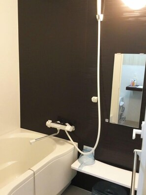 Separate tub and shower, hair dryer, towels, soap
