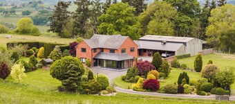 Stunning modern farmhouse retreat perched on a private hilltop in North Wales
