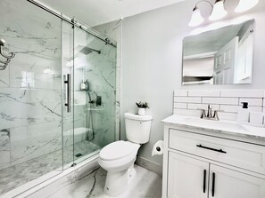 Shower, hair dryer, towels, soap