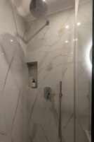 Junior Suite, Balcony, Sea View | Bathroom | Shower, hair dryer, slippers, towels