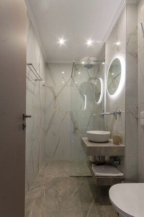 Junior Suite, Balcony, Sea View | Bathroom | Shower, hair dryer, slippers, towels - Corfelia Seaview Suites (Corfu)