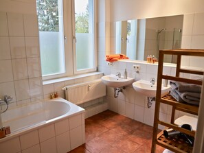 Shower, hair dryer, soap, toilet paper