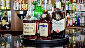 A bar with various bottles of alcohol, including Hennessy cognac, V.S. Martell cognac, and Ballantine's blended scotch whisky. - Sanel Hotel and Lounge Naivasha (Naivasha)