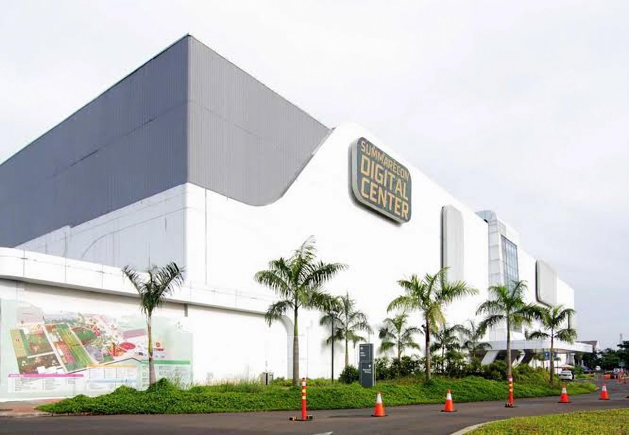 A modern building with a sign reading "SUMMARECON DIGITAL CENTER".