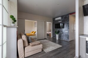 Appartement, climatisation, vue ville | Coin séjour