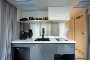 Fridge, microwave, stovetop, coffee/tea maker