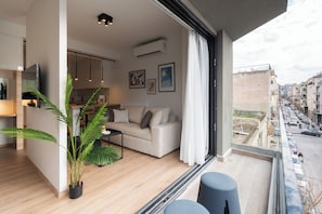 Premium Apartment, City View | Living area | 47-inch TV with cable channels