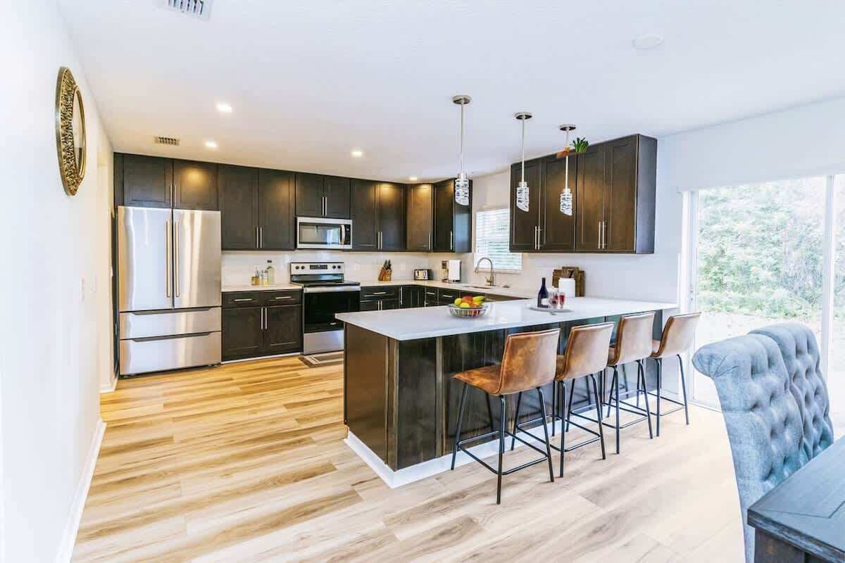 Fridge, stovetop, cookware/dishes/utensils, dining tables