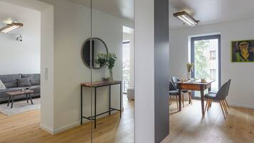 Comfort Apartment, Balcony, Garden View | In-room safe, desk, laptop workspace, iron/ironing board