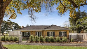 A two-story house with a tiled roof, a fenced yard, and a well-maintained lawn. - Kennington House, 3BR Home in Bendigo City (Kennington)