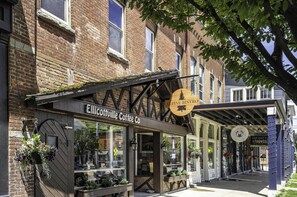 A storefront with a sign for 'Elicottville Coffee Co.' and 'Alpine Bistro.'