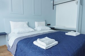 Habitación Deluxe, vista a la ciudad | Tabla de planchar con plancha y wifi gratis 