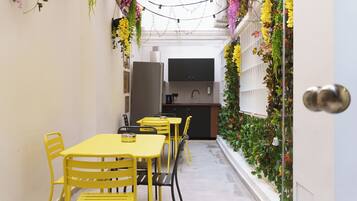 Mini-fridge, oven, stovetop, cookware/dishes/utensils