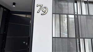A modern building facade with a large number '79' indicating the address. - Charming 2-bedroom house with WiFi, AC in fantastic Athina (Athina)