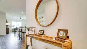 A kitchen with a wooden countertop, a mirror, and framed pictures. - 12 Mi to Avery Island: Spacious Family Home! (New Iberia)