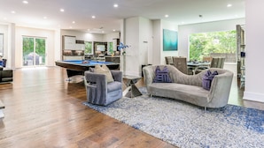 A spacious living room with a pool table, a sofa, and a dining area. - Luxe Buckhead Retreat 6 Mi to Dtwn Atlanta (Atlanta)