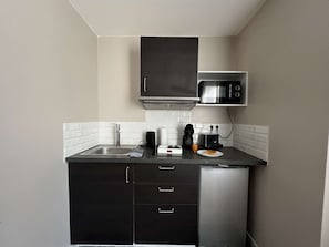 Fridge, microwave, coffee/tea maker, toaster