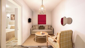 Familie-studiosuite | Oppholdsområde | En 40-centimeters TV med Parabol-TV