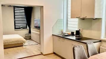 Family Suite, City View | Private kitchen | Coffee/tea maker, electric kettle, cookware/dishes/utensils