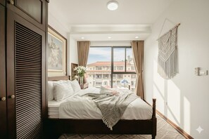 Desk, laptop workspace, blackout curtains, iron/ironing board