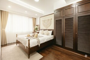 Desk, laptop workspace, blackout drapes, iron/ironing board - Lunaria Two Bedroom Apartment (Hanoi)