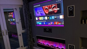 A modern living room with a large flat-screen TV mounted on the wall displaying various streaming services. - Private 2 Bedroom Apartment -edinburgh - Sleeps 4 (Edinburgh)