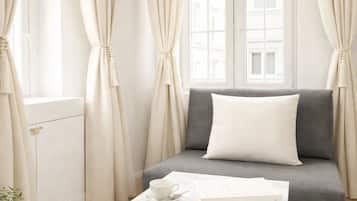 Premium Studio, Courtyard View | Living area | 80-cm Smart TV with digital channels