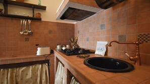 Fridge, stovetop, toaster, cookware/dishes/utensils