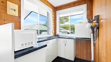 Fridge, microwave, toaster, cookware/dishes/utensils