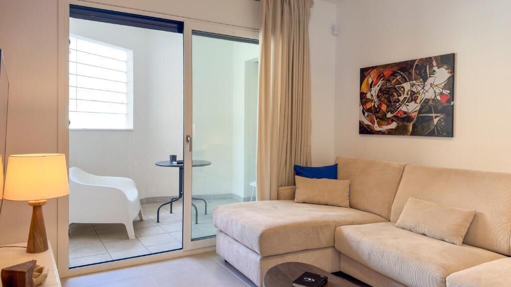 Apartment, Patio, City View | Living area | Flat-screen TV