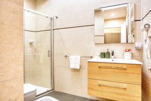 Apartment, 1 Bedroom | Bathroom | Shower, free toiletries, hair dryer, bidet