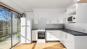 Fridge, microwave, stovetop, coffee/tea maker