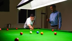 A pool table with balls and a person playing. - Country Inn Tarika Riverside Resort Jim Corbett (Ramnagar)