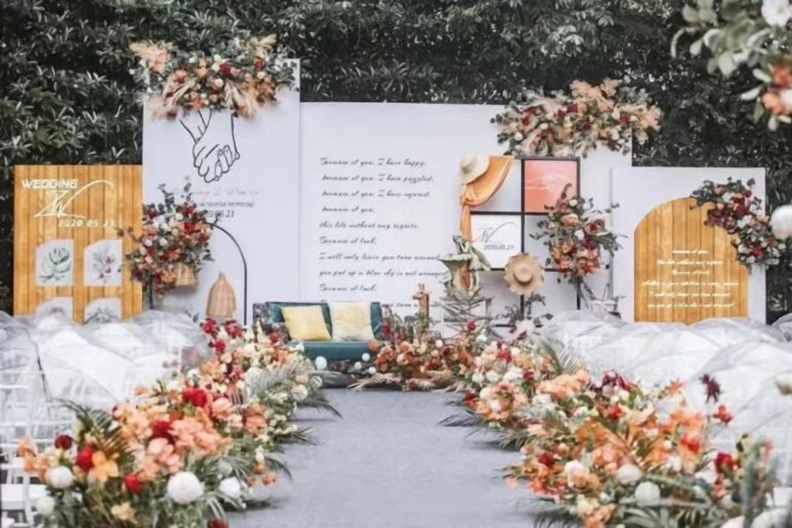 A wedding aisle decorated with floral arrangements and a wooden archway.