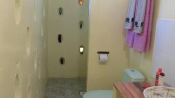 Shower, slippers, towels, soap