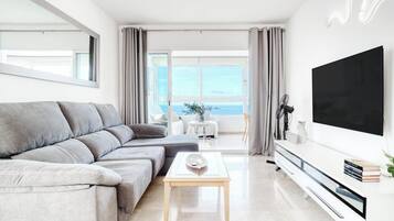 Luxury Penthouse, Balcony, City View | Living area | TV