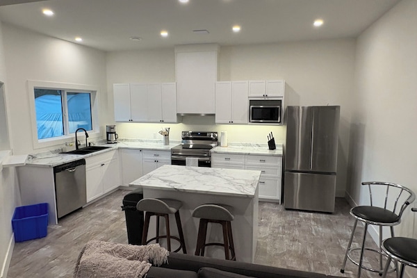 Open, updated kitchen with full sized appliances.