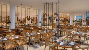 A spacious restaurant with wooden furniture and a modern interior design. - The Eden Beruwala (Beruwala)