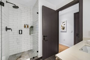 Shower, hair dryer, towels, shampoo