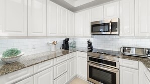 Apartamento, varias camas (Beach Colony West 13D) | Cocina privada | Papel de cocina