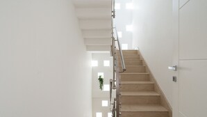 A staircase with a metal handrail leading to a landing. - Borgo dei Cedri Apartment 2 by Wonderful Italy (Bari)