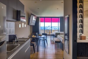 Junior Double Room, 2 Double Beds, Terrace | Living area | 75-inch Smart TV with digital channels - Colony Residences & Suites (Mexico City)