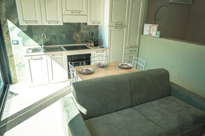 Studio Suite Superior, patio, pemandangan kebun | Area keluarga