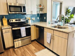 Fridge, stovetop, dishwasher, cookware/dishes/utensils