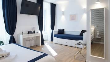 Deluxe Quadruple Room, City View | Desk, laptop workspace, blackout curtains, soundproofing